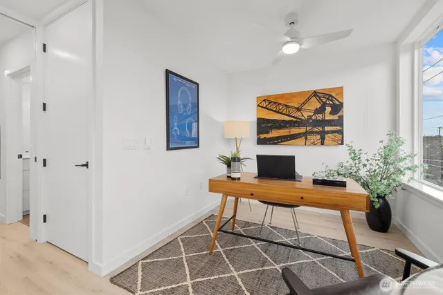 a living room with furniture and a floor to ceiling window