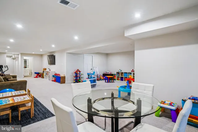 a very nice looking dining room with furniture