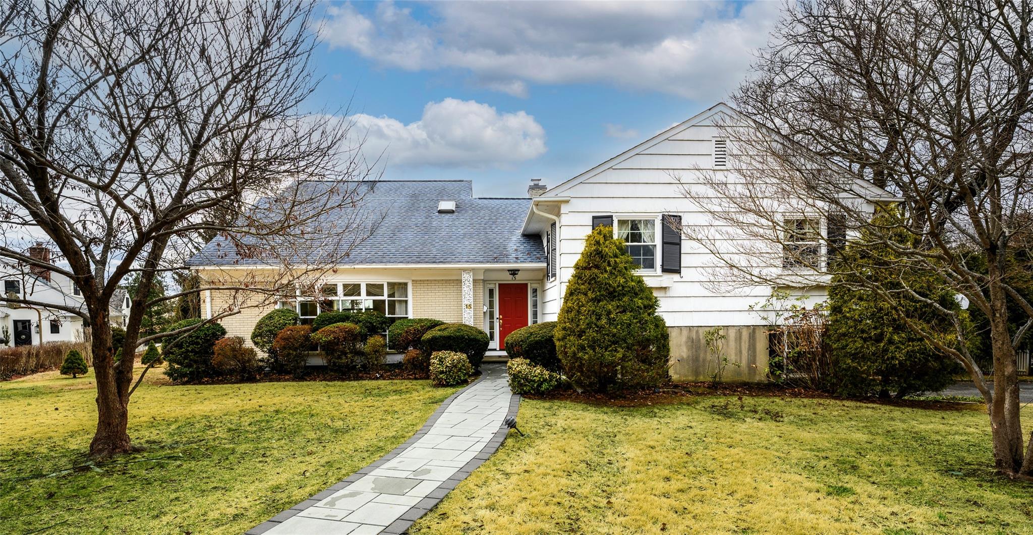 a front view of a house with garden