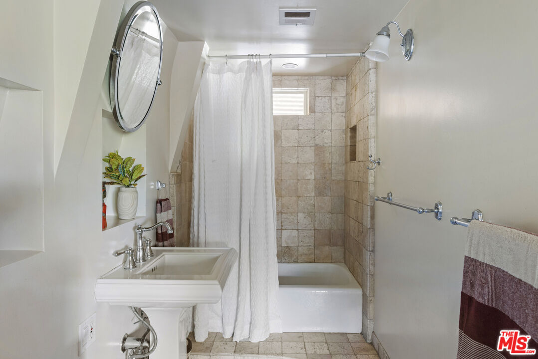 16617 Vasquez Canyon Road Canyon Country, CA 91351 - Photo 19 of 43 a bathroom with a sink a toilet and shower