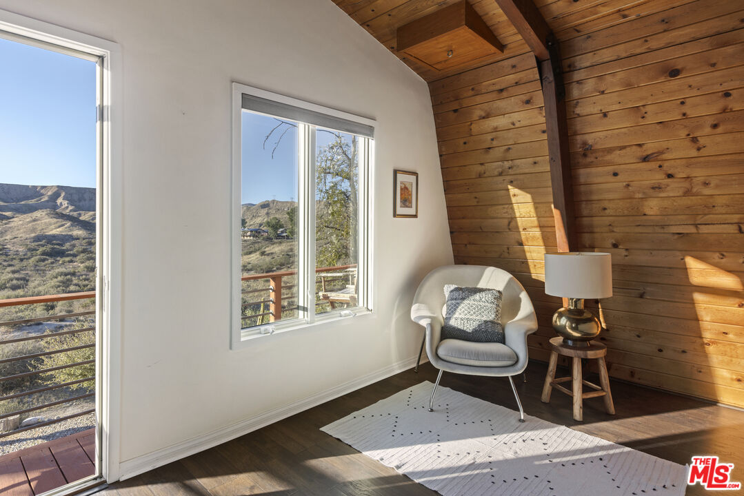 16617 Vasquez Canyon Road Canyon Country, CA 91351 - Photo 20 of 43 a bedroom with furniture and a window