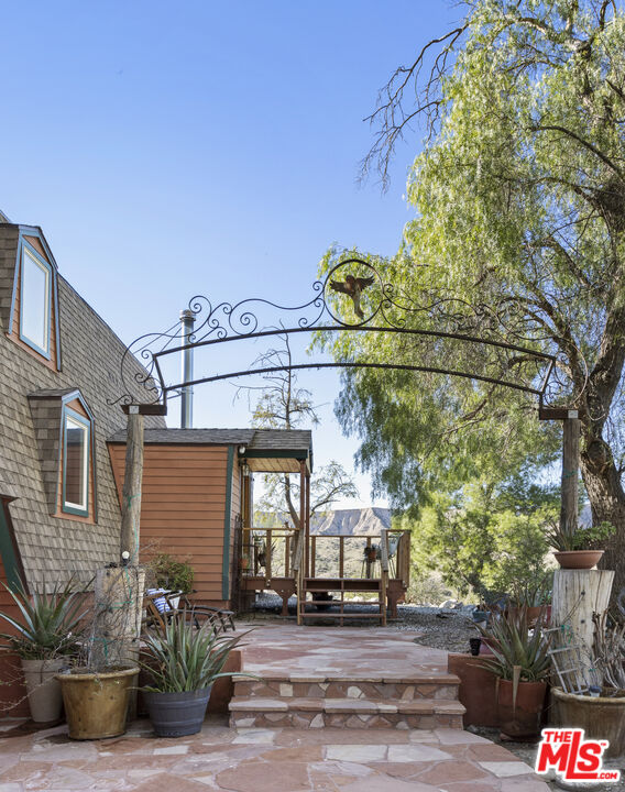 16617 Vasquez Canyon Road Canyon Country, CA 91351 - Photo 2 of 43 a front view of a house with garden