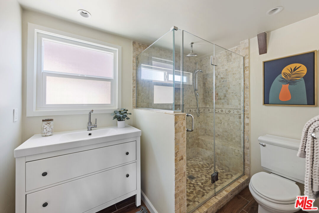 16617 Vasquez Canyon Road Canyon Country, CA 91351 - Photo 27 of 43 a bathroom with a sink a toilet and shower