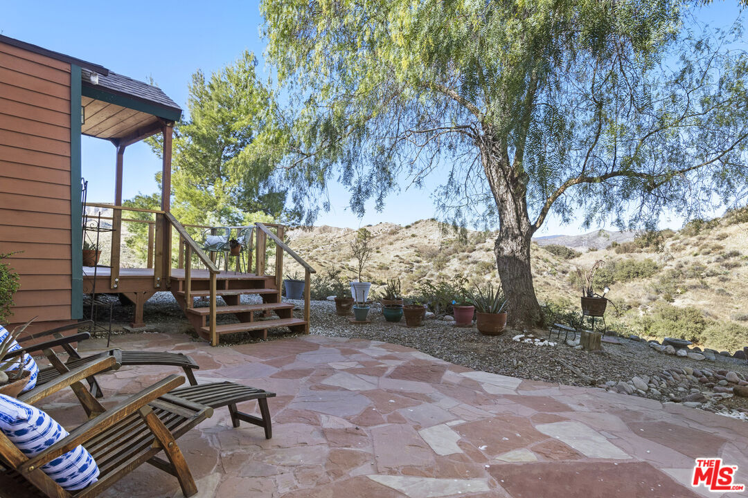 16617 Vasquez Canyon Road Canyon Country, CA 91351 - Photo 30 of 43 a backyard of a house with outdoor seating