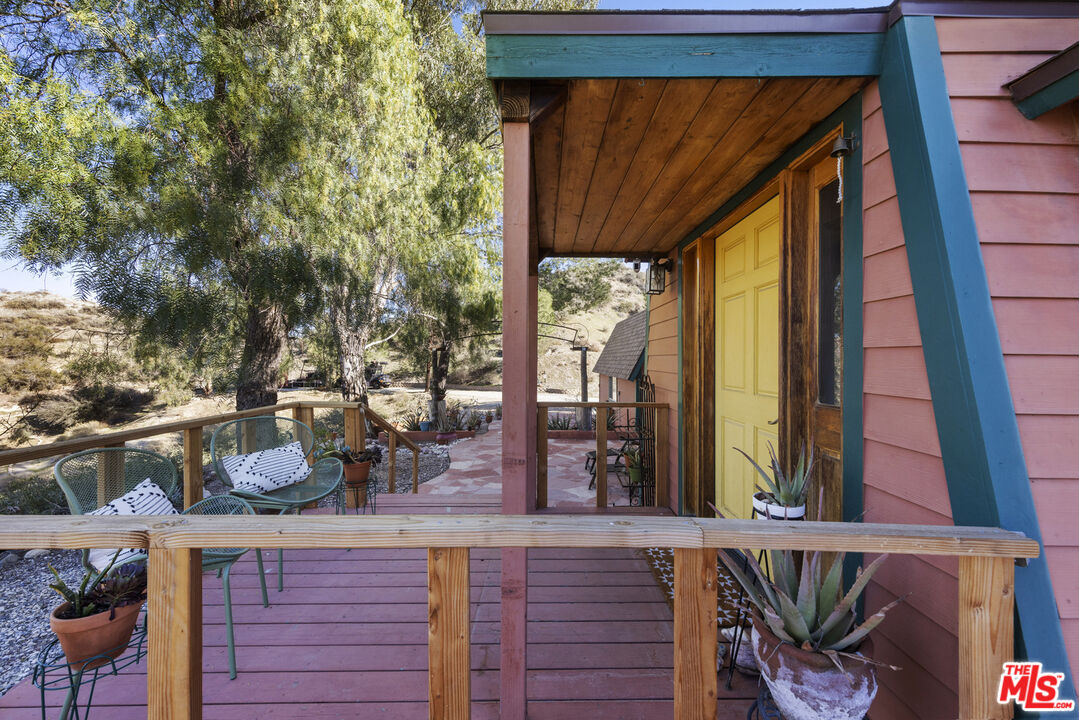 16617 Vasquez Canyon Road Canyon Country, CA 91351 - Photo 31 of 43 a room with wooden floor and large window