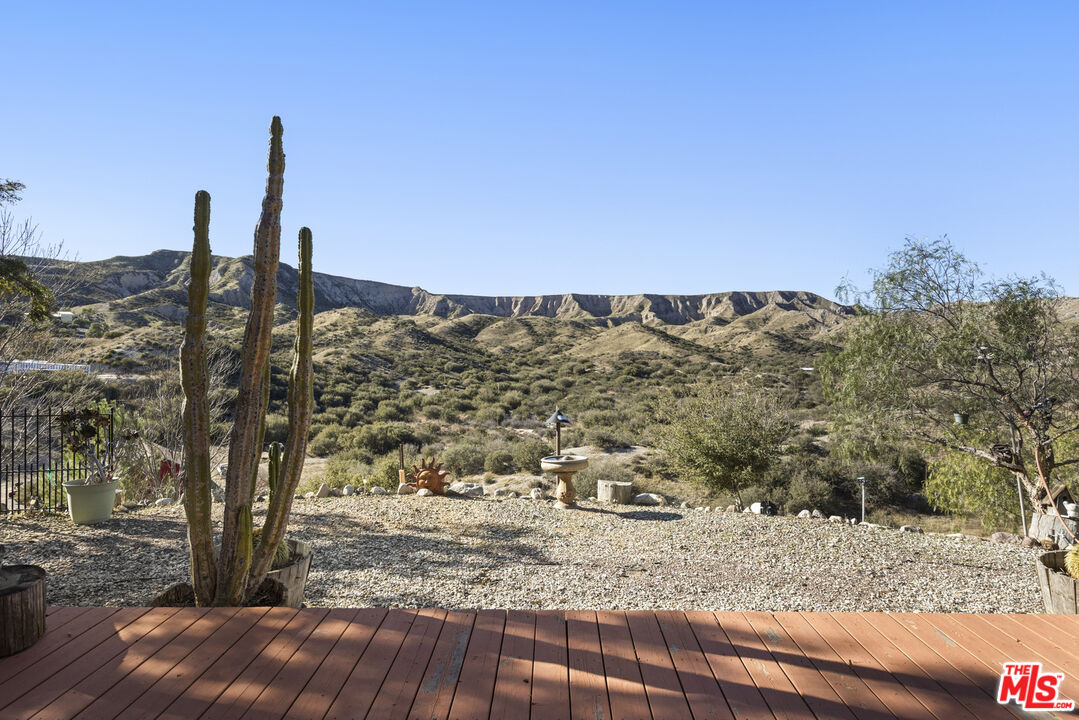 16617 Vasquez Canyon Road Canyon Country, CA 91351 - Photo 35 of 43 a view of a dry yard with wooden fence