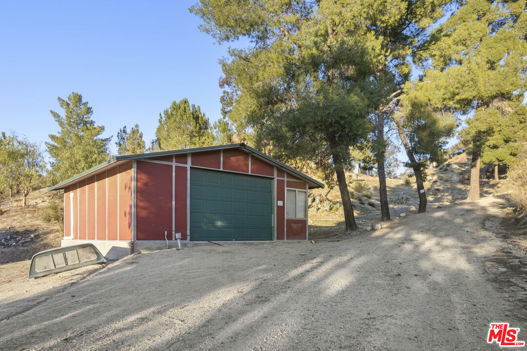 16617 Vasquez Canyon Road Canyon Country, CA 91351 - Photo 37 of 43 a view of a house with a yard and tree s