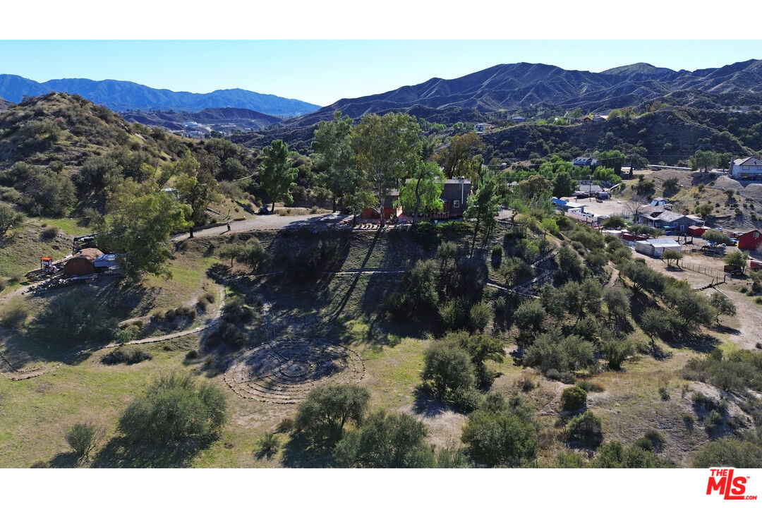 16617 Vasquez Canyon Road Canyon Country, CA 91351 - Photo 43 of 43 a view of a lush green hillside and houses