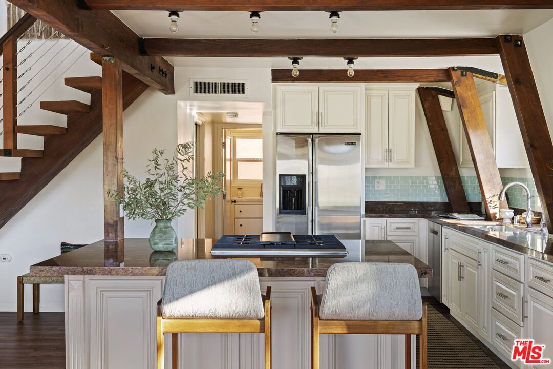 16617 Vasquez Canyon Road Canyon Country, CA 91351 - Photo 6 of 43 a kitchen with a stove and a white refrigerator