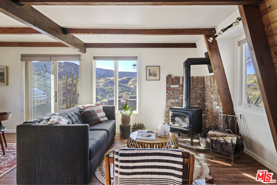 16617 Vasquez Canyon Road Canyon Country, CA 91351 - Photo 7 of 43 a living room with furniture and a floor to ceiling window