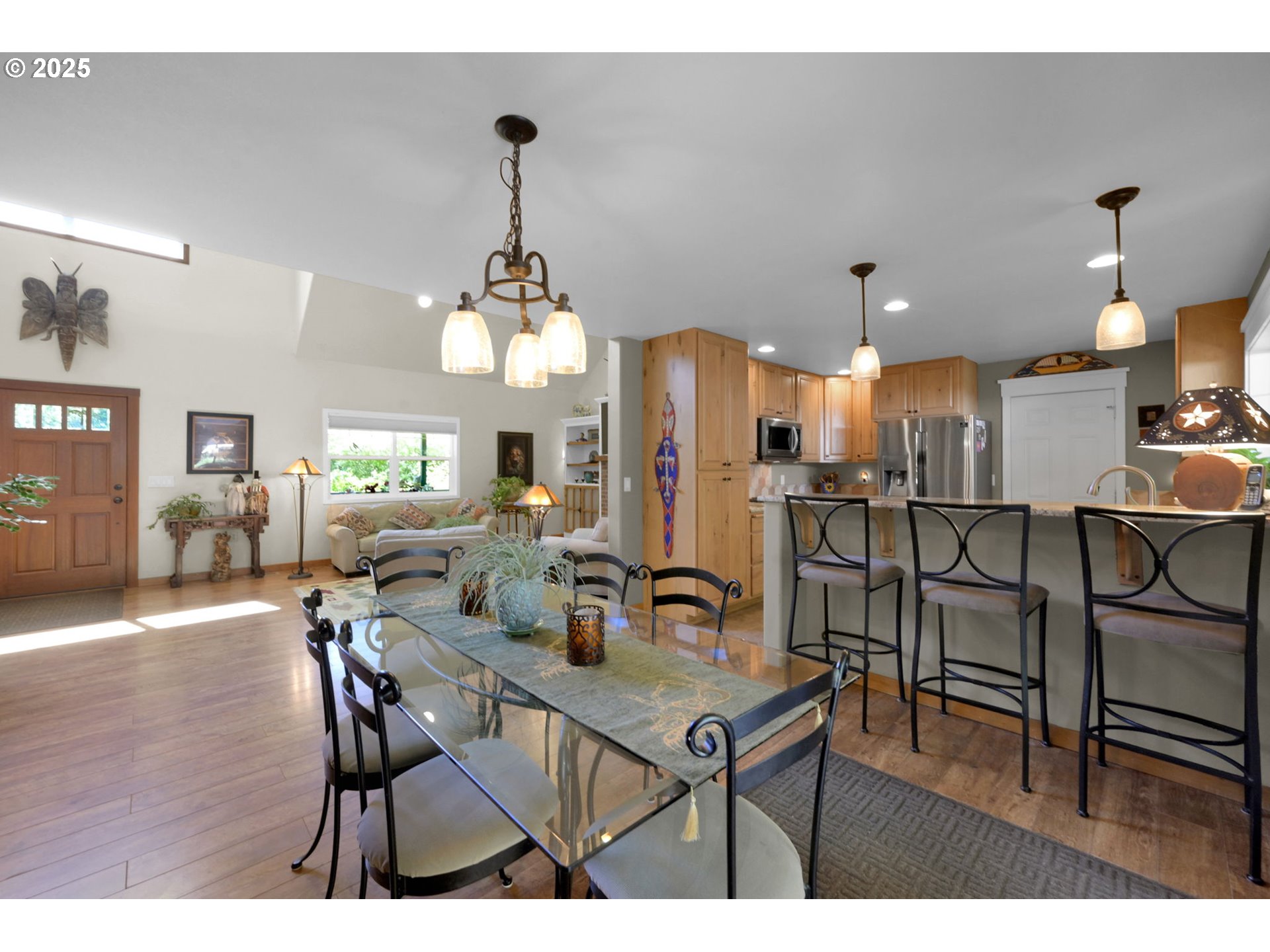 23859 Suttle Road Veneta, OR 97487 - Photo 15 of 46 a view of a dining room with furniture and wooden floor