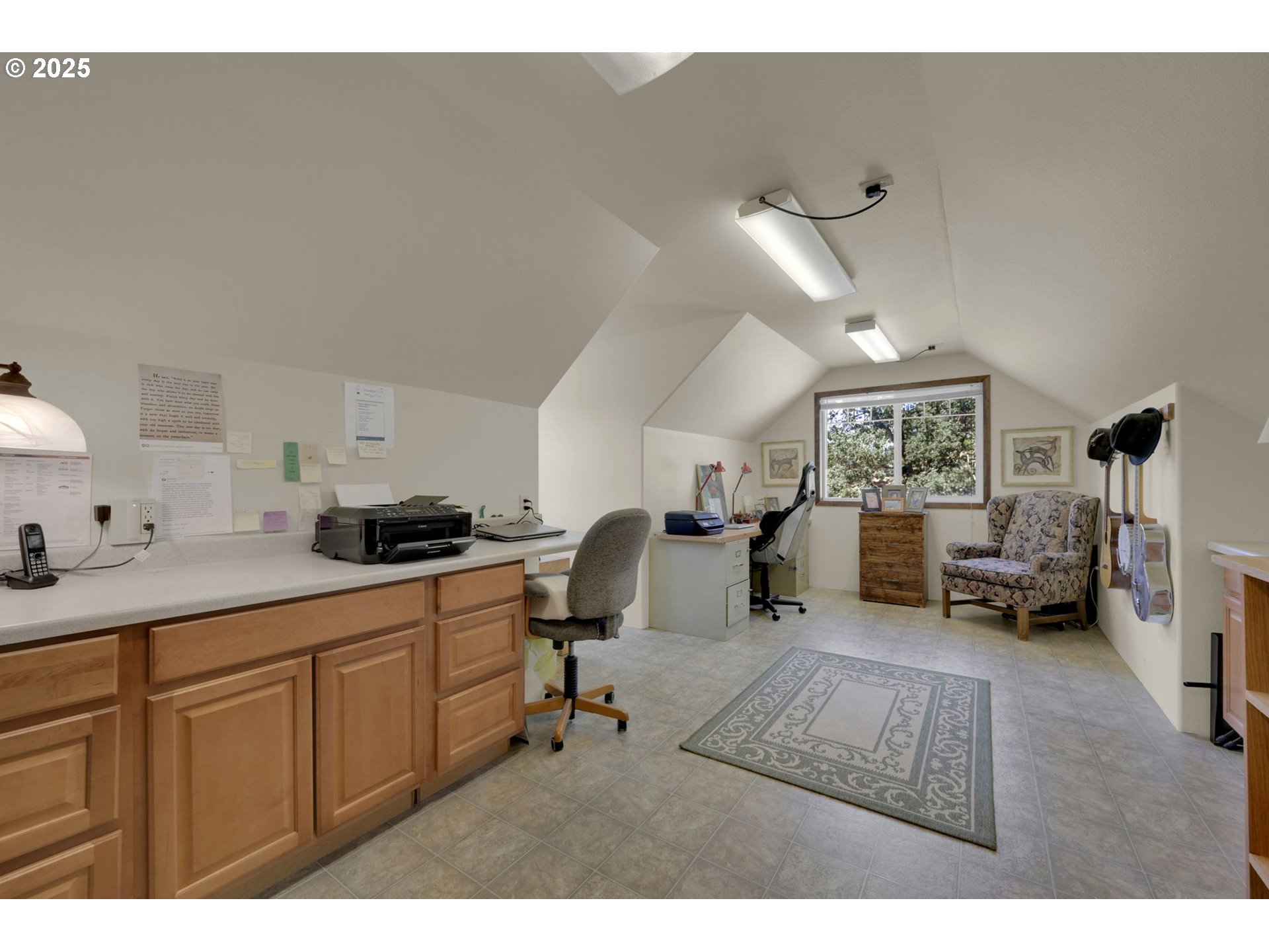 23859 Suttle Road Veneta, OR 97487 - Photo 24 of 46 a living room with furniture a dining table and a fireplace