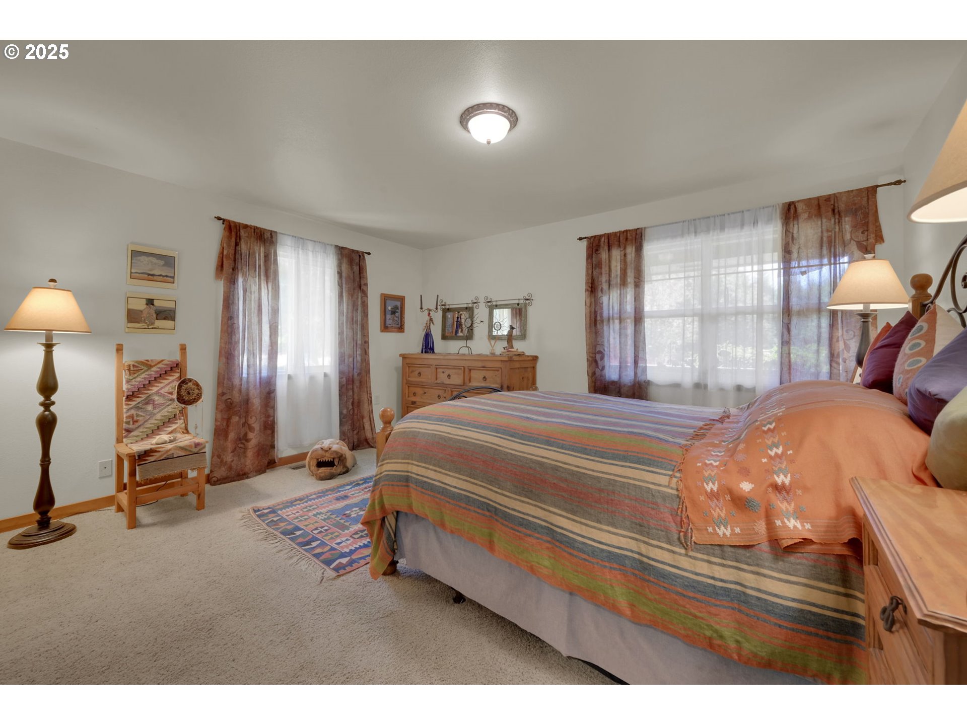 23859 Suttle Road Veneta, OR 97487 - Photo 26 of 46 a bedroom with a bed and a mirror