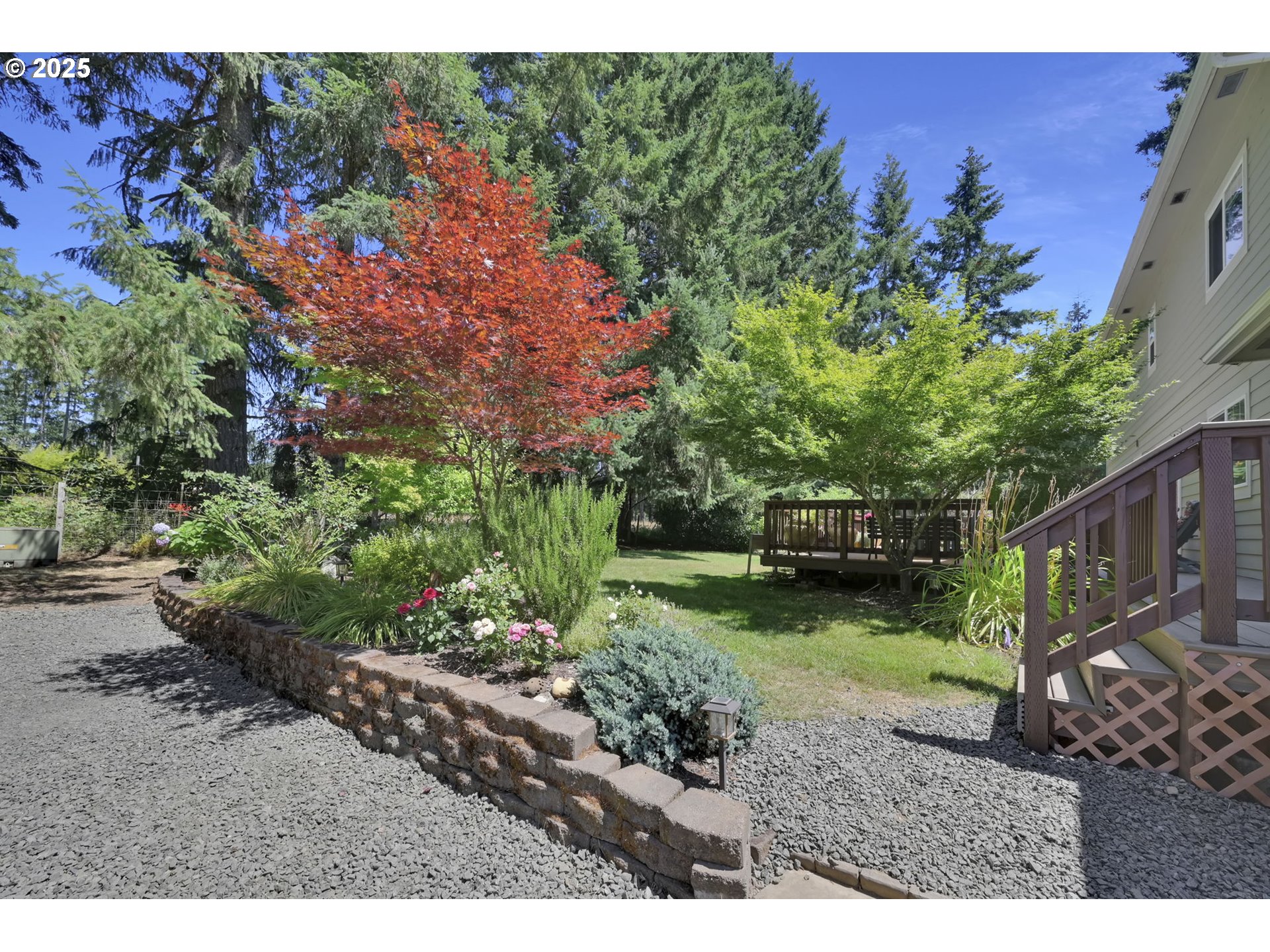 23859 Suttle Road Veneta, OR 97487 - Photo 33 of 46 a backyard of a house with a garden and outdoor seating