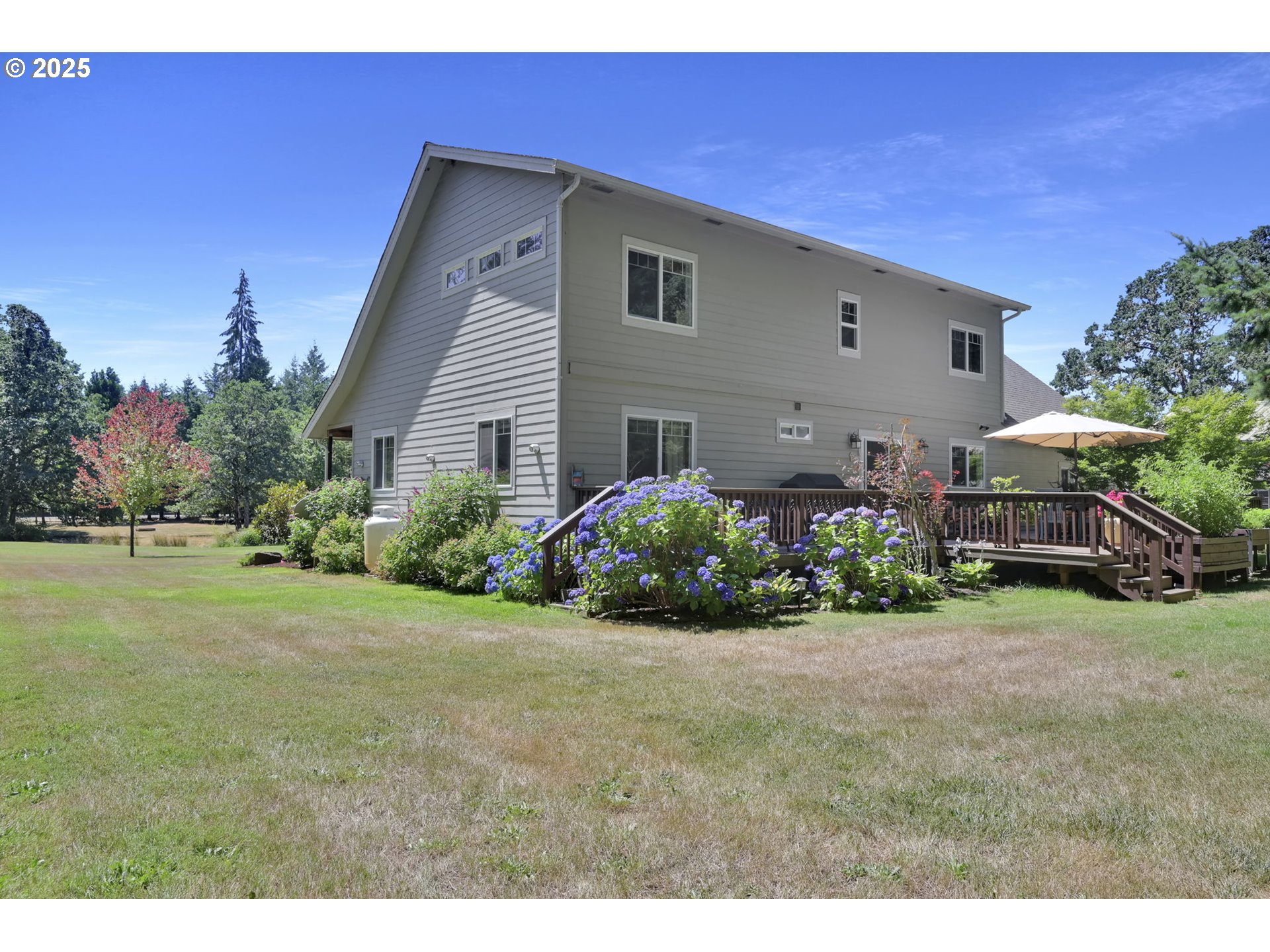 23859 Suttle Road Veneta, OR 97487 - Photo 34 of 46 a front view of a house with a garden