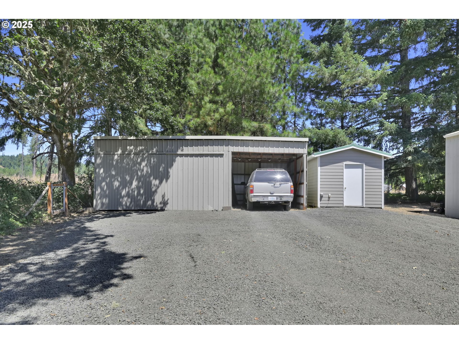 23859 Suttle Road Veneta, OR 97487 - Photo 42 of 46 a couple of table and a fire pit in the middle of a yard