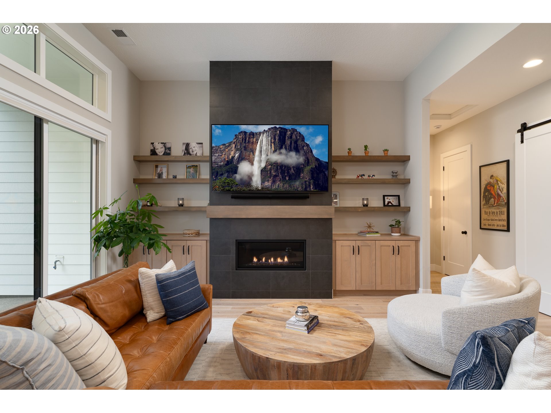 8044 Southwest Knudsen Place Portland, OR 97223 - Photo 12 of 46 a living room with furniture and a fireplace
