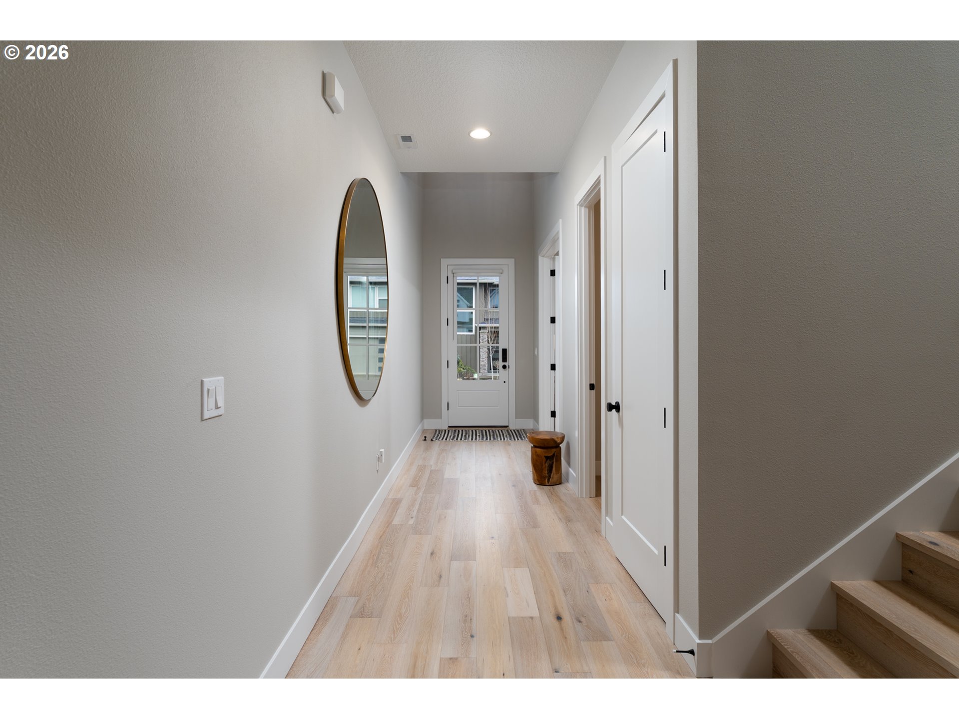 8044 Southwest Knudsen Place Portland, OR 97223 - Photo 16 of 46 a view of a hallway with wooden floor
