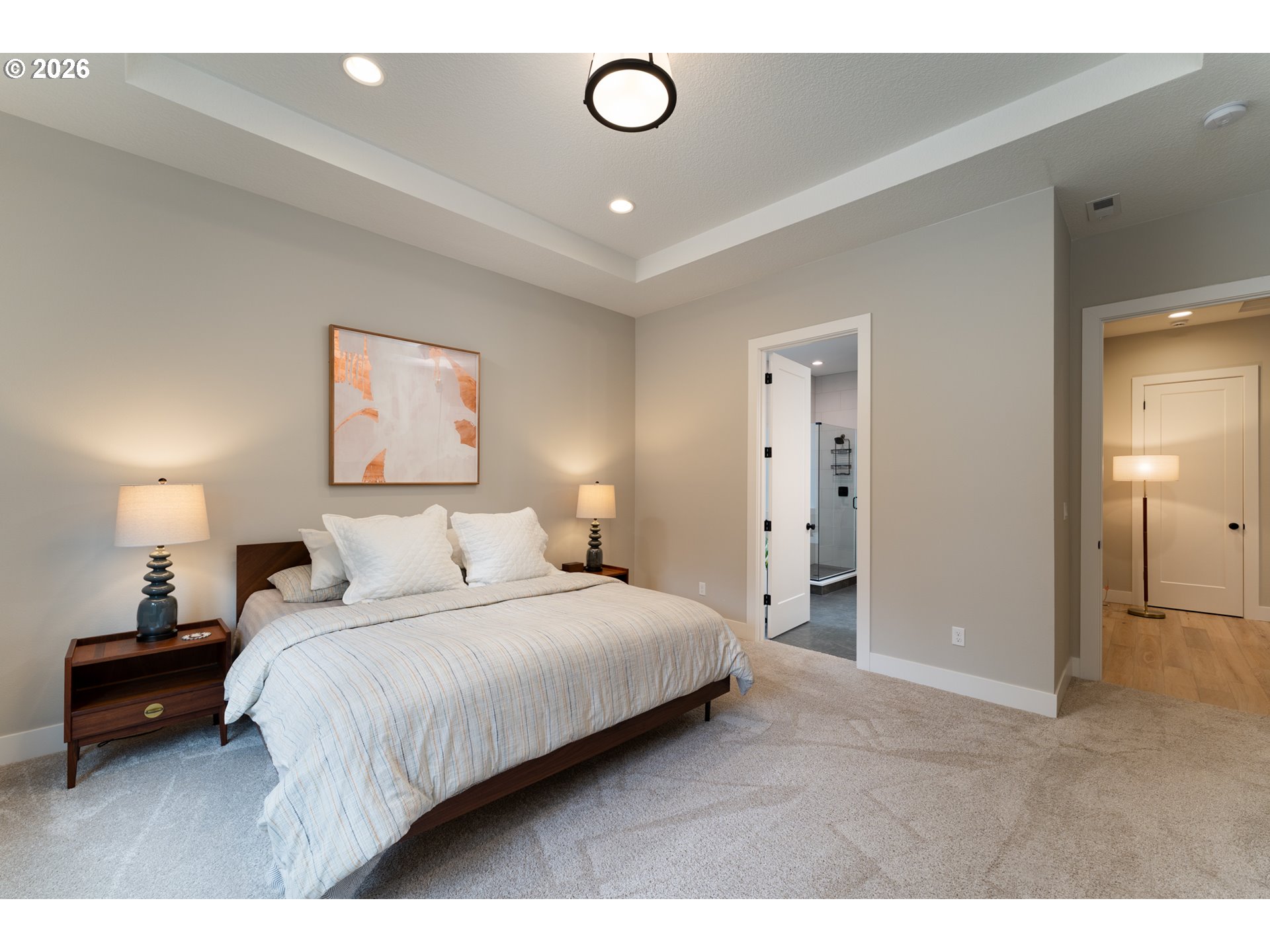 8044 Southwest Knudsen Place Portland, OR 97223 - Photo 25 of 46 a bedroom with a bed and a lamp