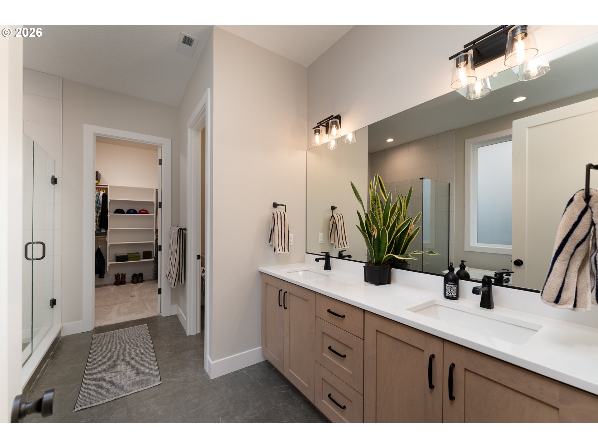 8044 Southwest Knudsen Place Portland, OR 97223 - Photo 26 of 46 a bathroom with a sink and a mirror