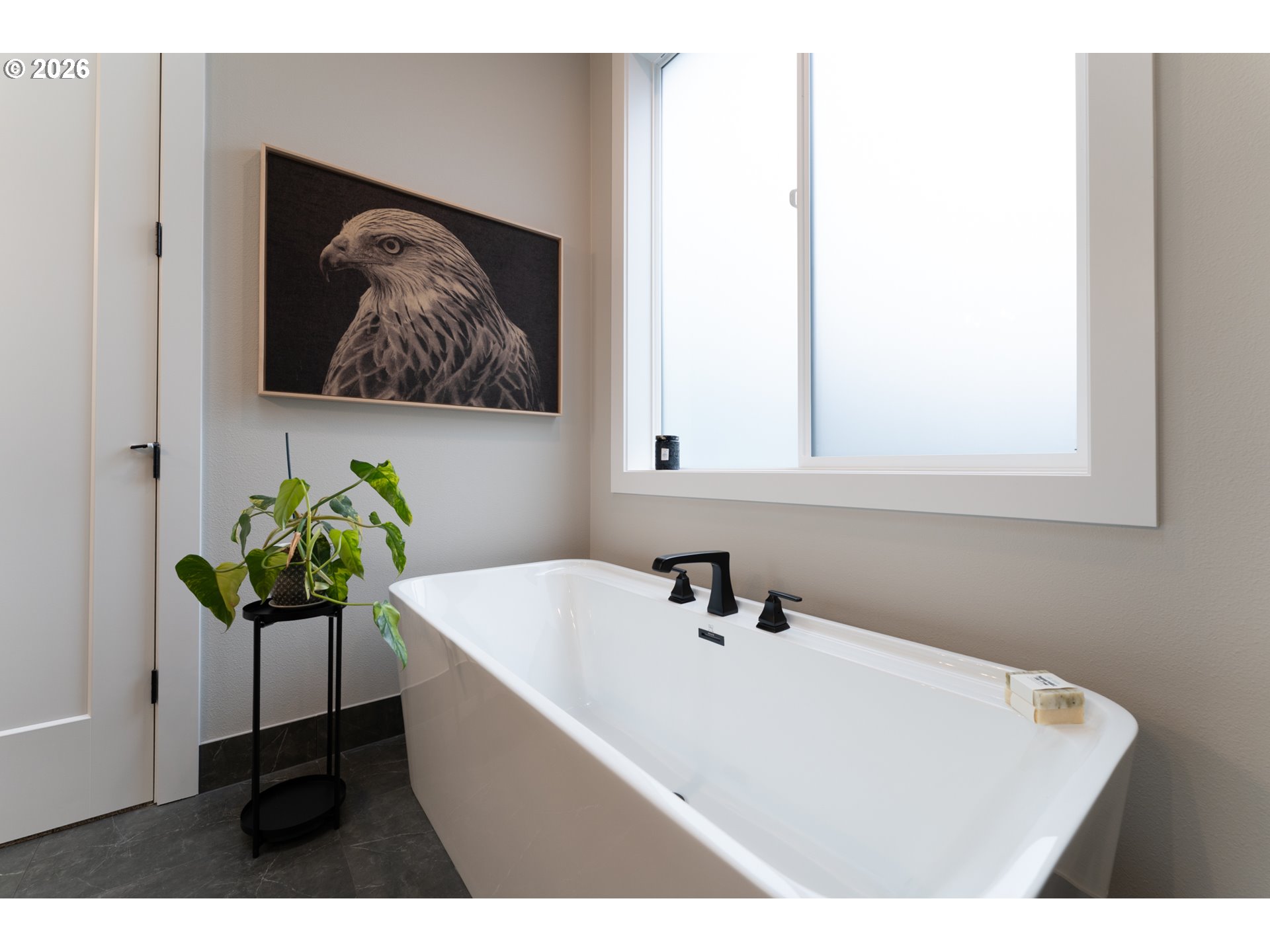 8044 Southwest Knudsen Place Portland, OR 97223 - Photo 28 of 46 a white bath tub sitting next to a white sink