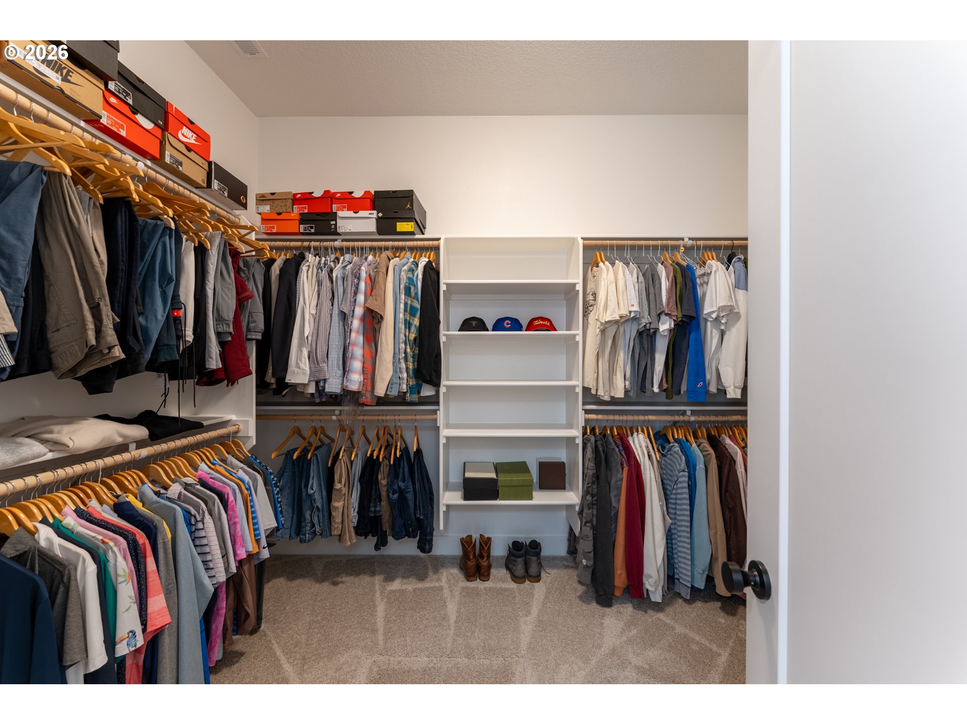 8044 Southwest Knudsen Place Portland, OR 97223 - Photo 30 of 46 a view of walk in closet with clothes and shoes