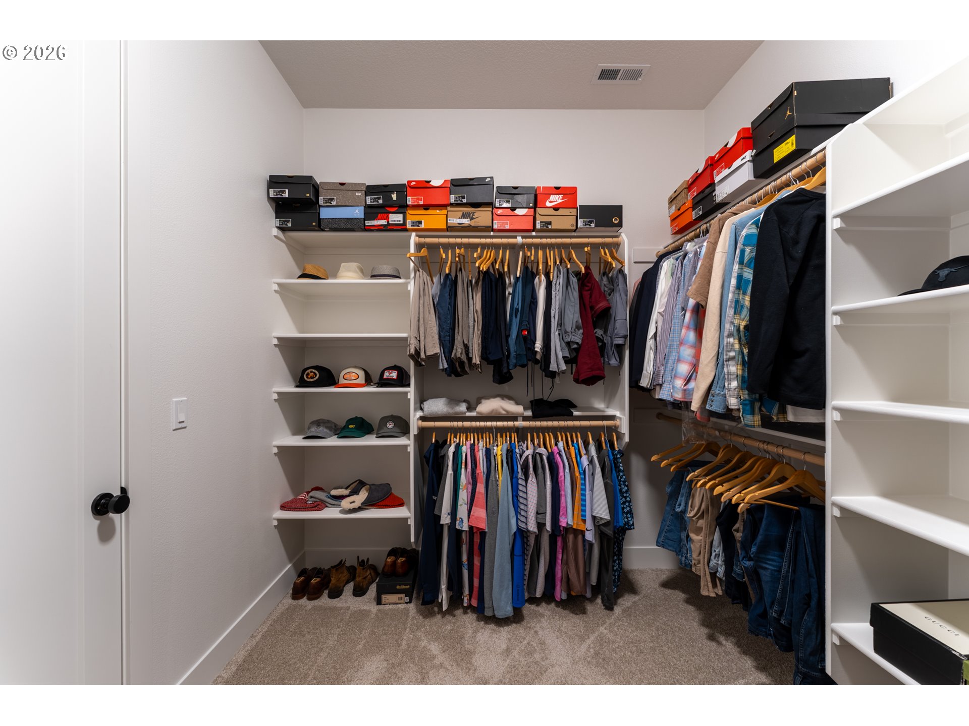 8044 Southwest Knudsen Place Portland, OR 97223 - Photo 31 of 46 a view of walk in closet with clothes and shoes