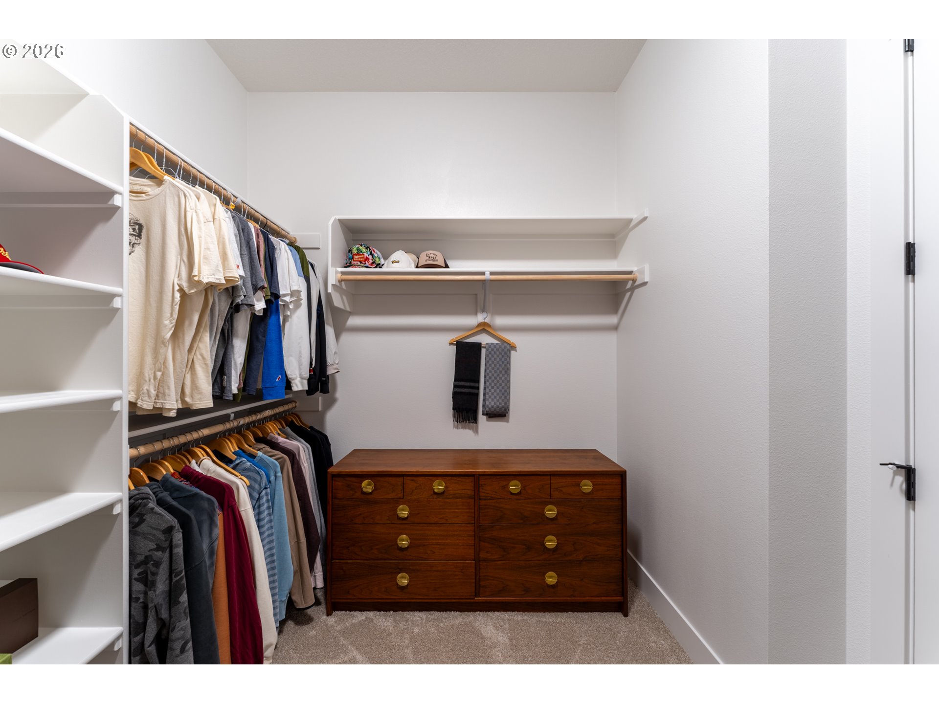 8044 Southwest Knudsen Place Portland, OR 97223 - Photo 32 of 46 a view of walk in closet with clothes and shoes