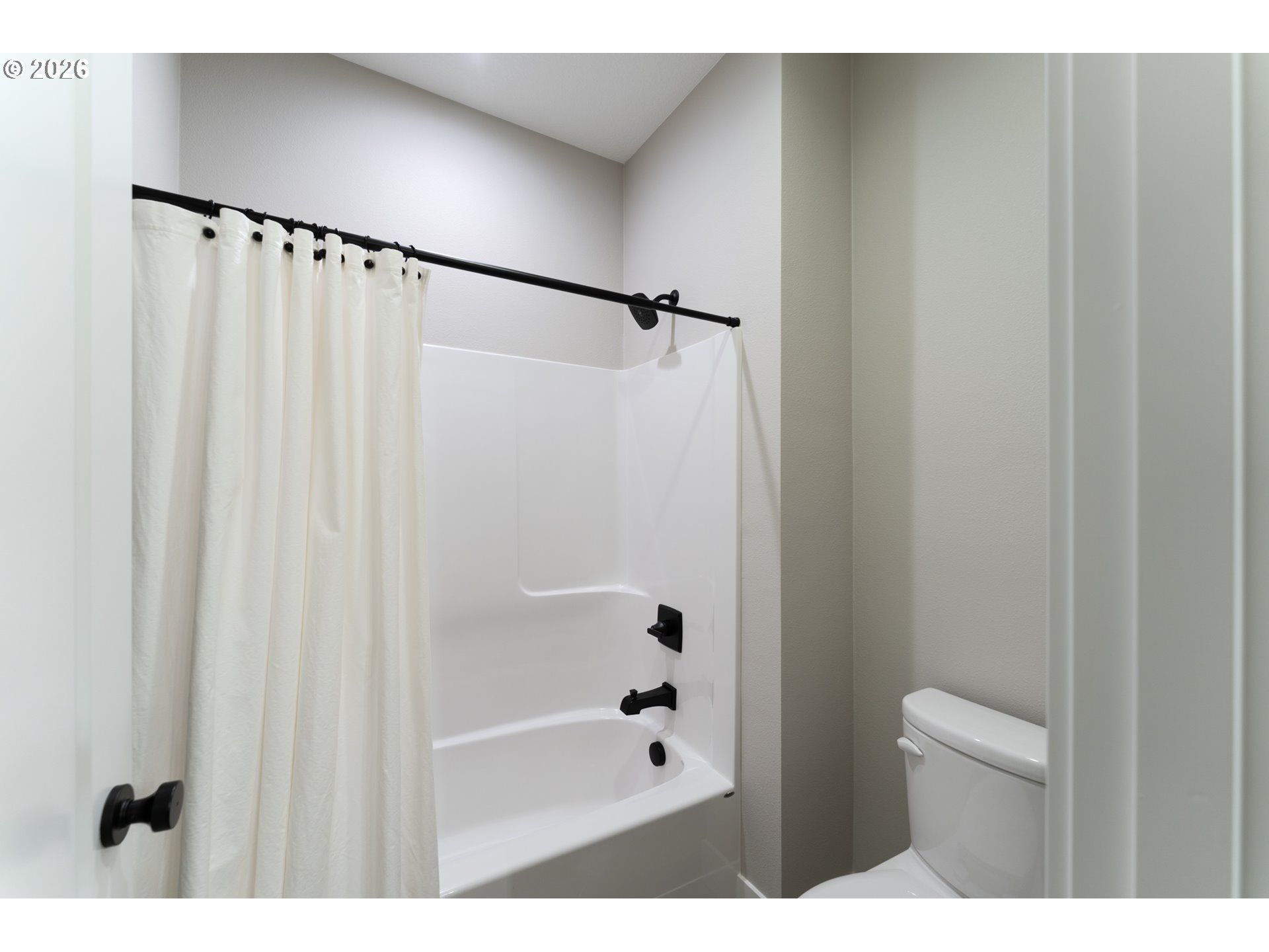 8044 Southwest Knudsen Place Portland, OR 97223 - Photo 38 of 46 a bathroom with a shower and a mirror