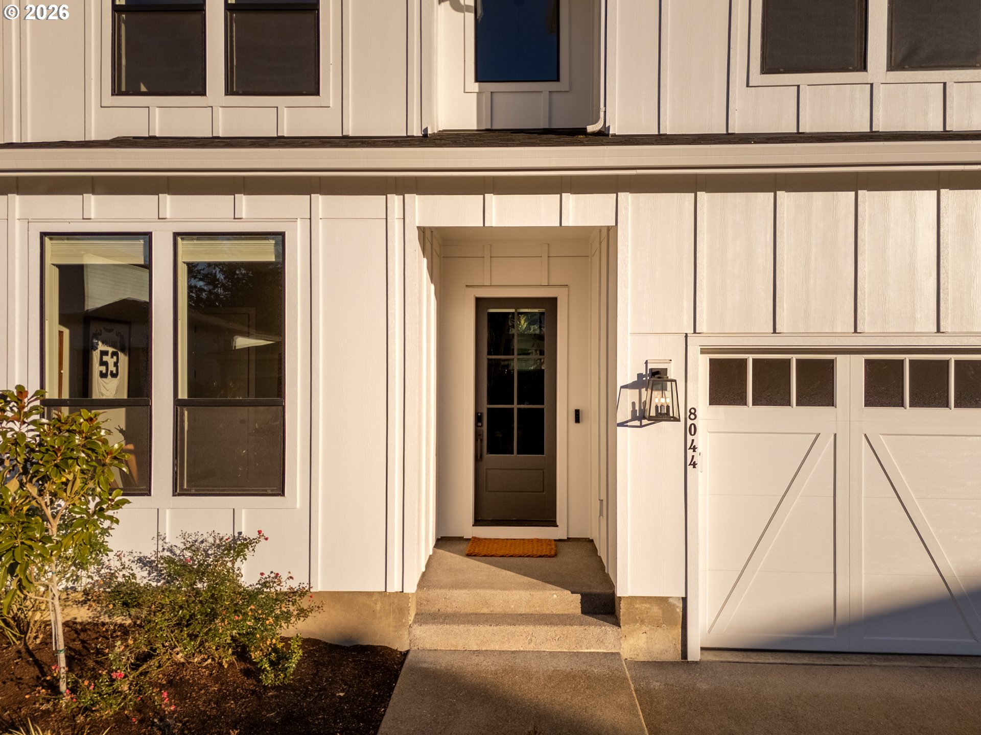 8044 Southwest Knudsen Place Portland, OR 97223 - Photo 5 of 46 a front view of a house with a yard