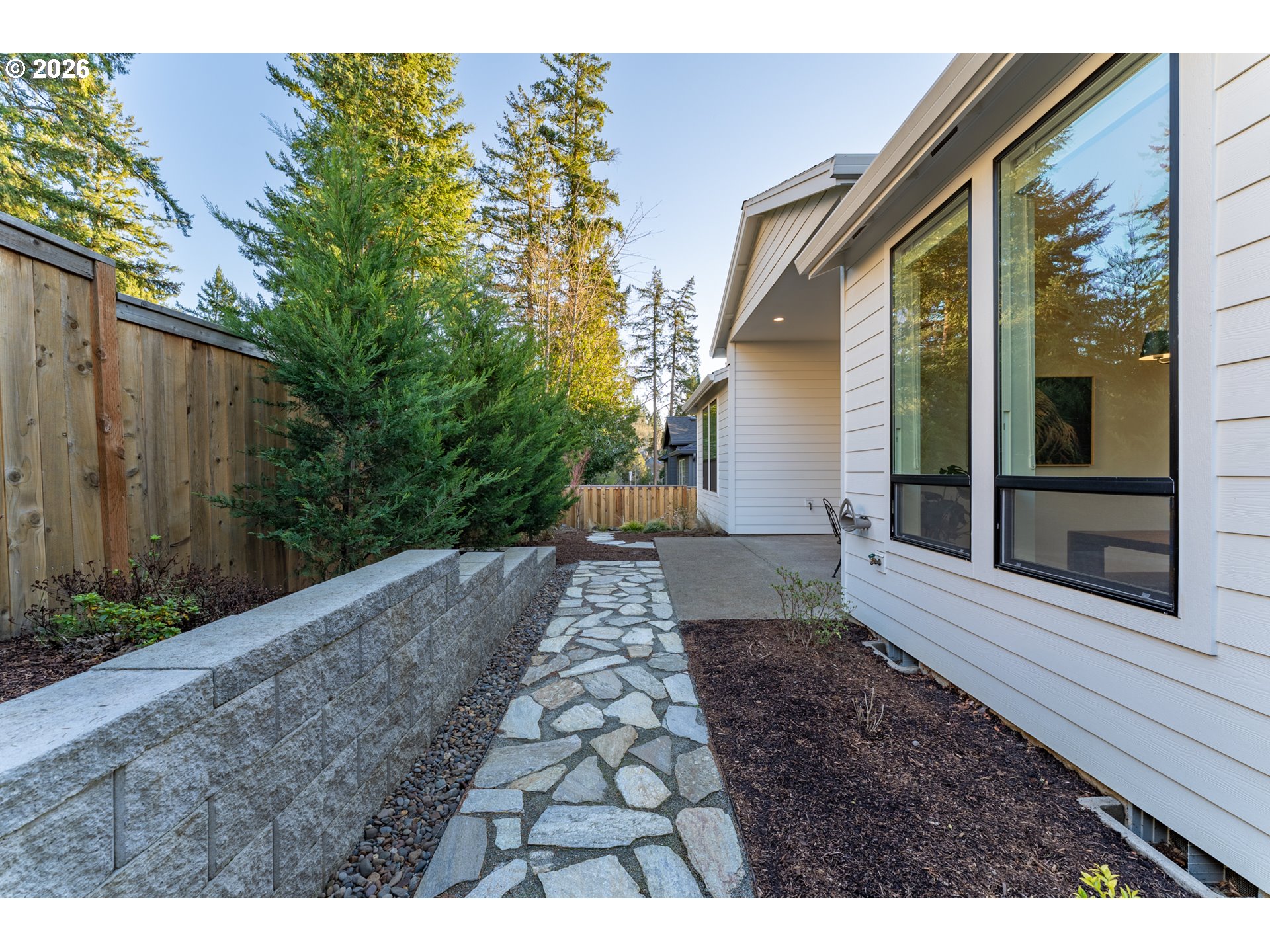 8044 Southwest Knudsen Place Portland, OR 97223 - Photo 6 of 46 a view of a pathway with a house in the background
