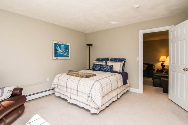 30 Pheasant Hollow Road Natick, MA 01760 - Photo 24 of 30 a bedroom with a bed and a couch
