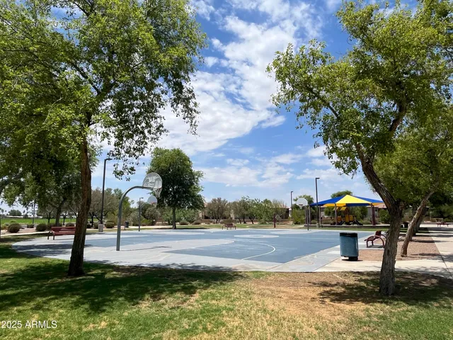 a view of a park with swings and slides