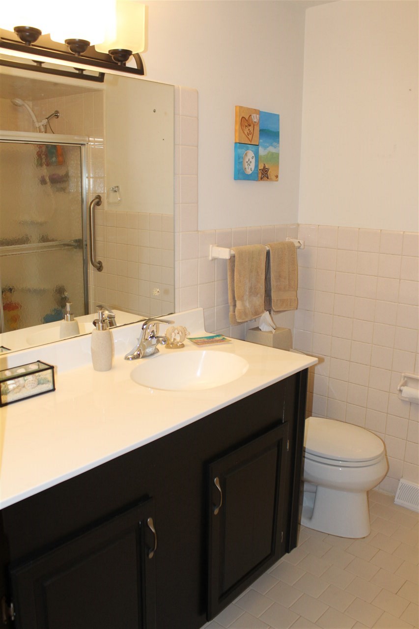 3511 North View Road Rockford, IL 61107 - Photo 13 of 15 a bathroom with a sink and a mirror
