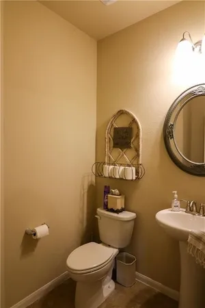 a living room with furniture and two window