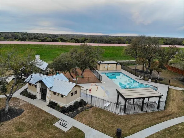 a view of a house with a yard and garden