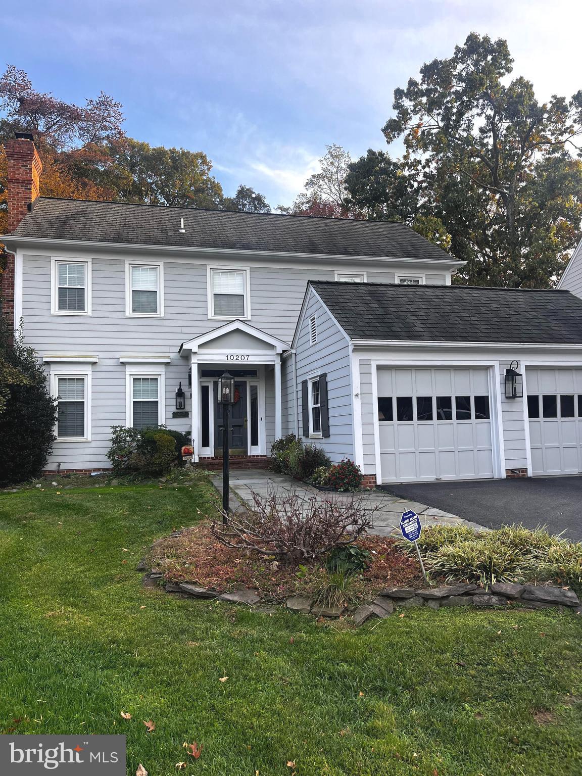 10207 Sundance Court Potomac, MD 20854 - Photo 2 of 21 a front view of a house with a garden