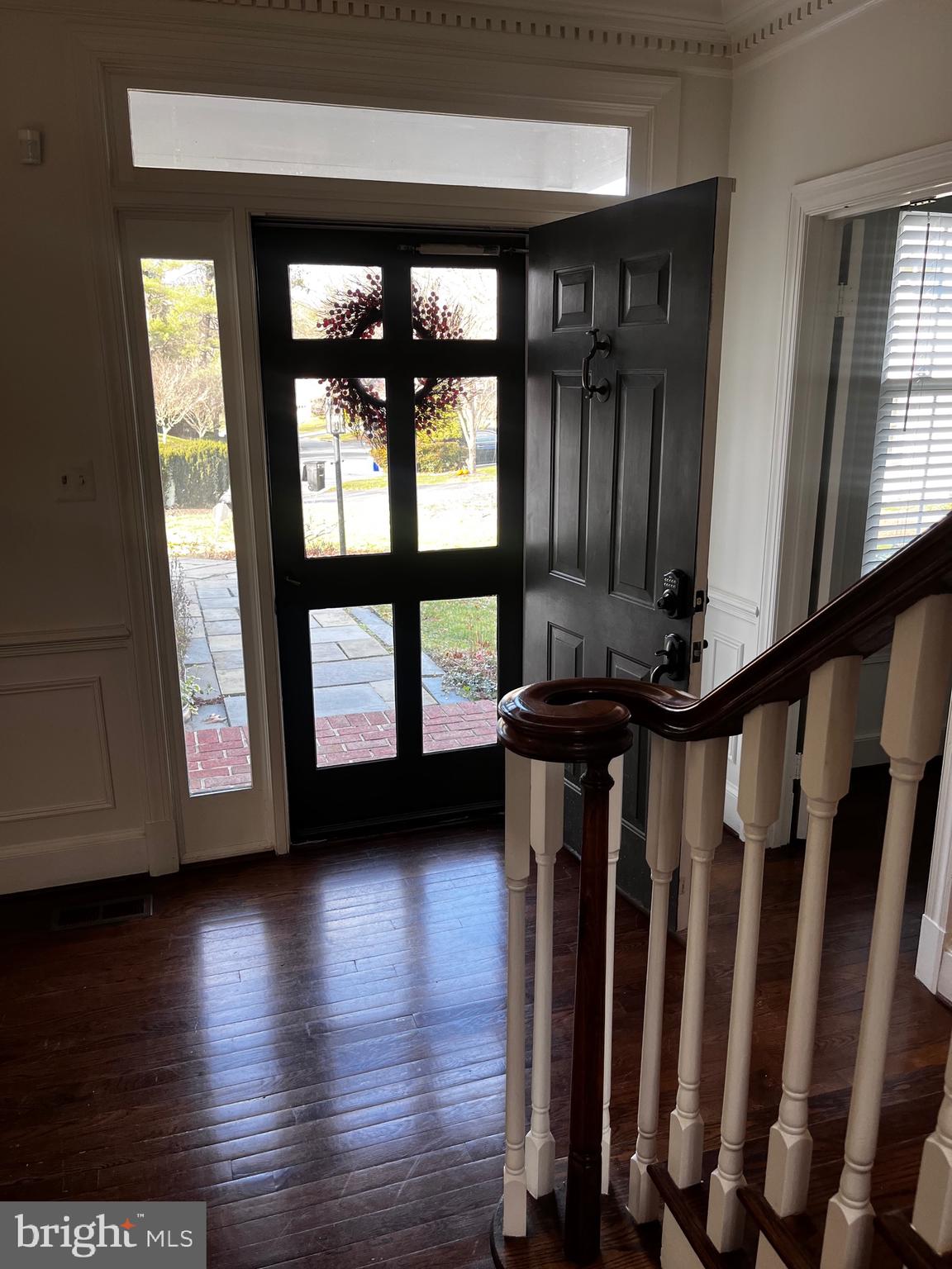 10207 Sundance Court Potomac, MD 20854 - Photo 21 of 21 a view of front door with wooden floor and stairs