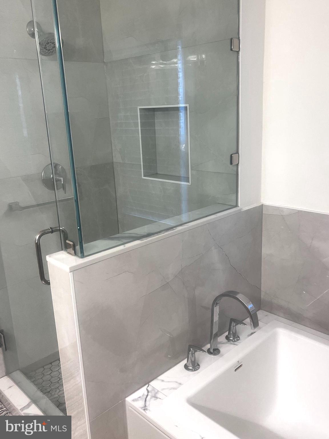 10207 Sundance Court Potomac, MD 20854 - Photo 4 of 21 a bathroom with a sink and a large mirror