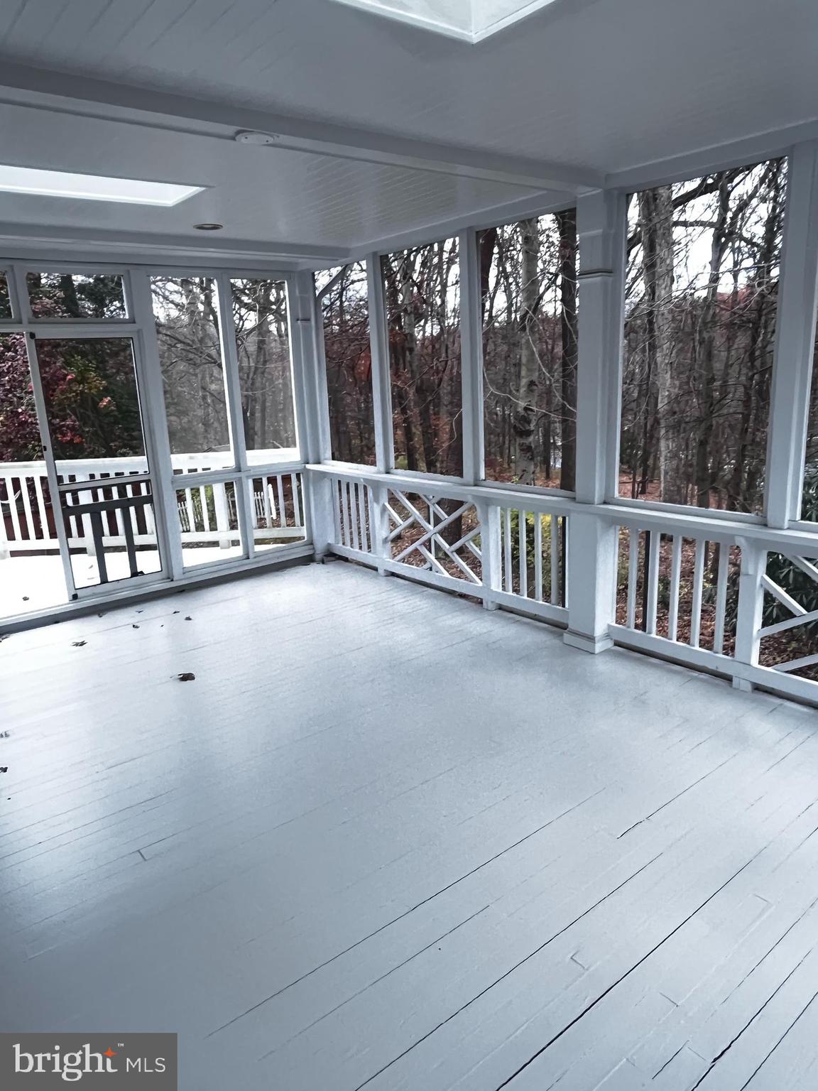 10207 Sundance Court Potomac, MD 20854 - Photo 5 of 21 a view of an empty room with stairs and a large window