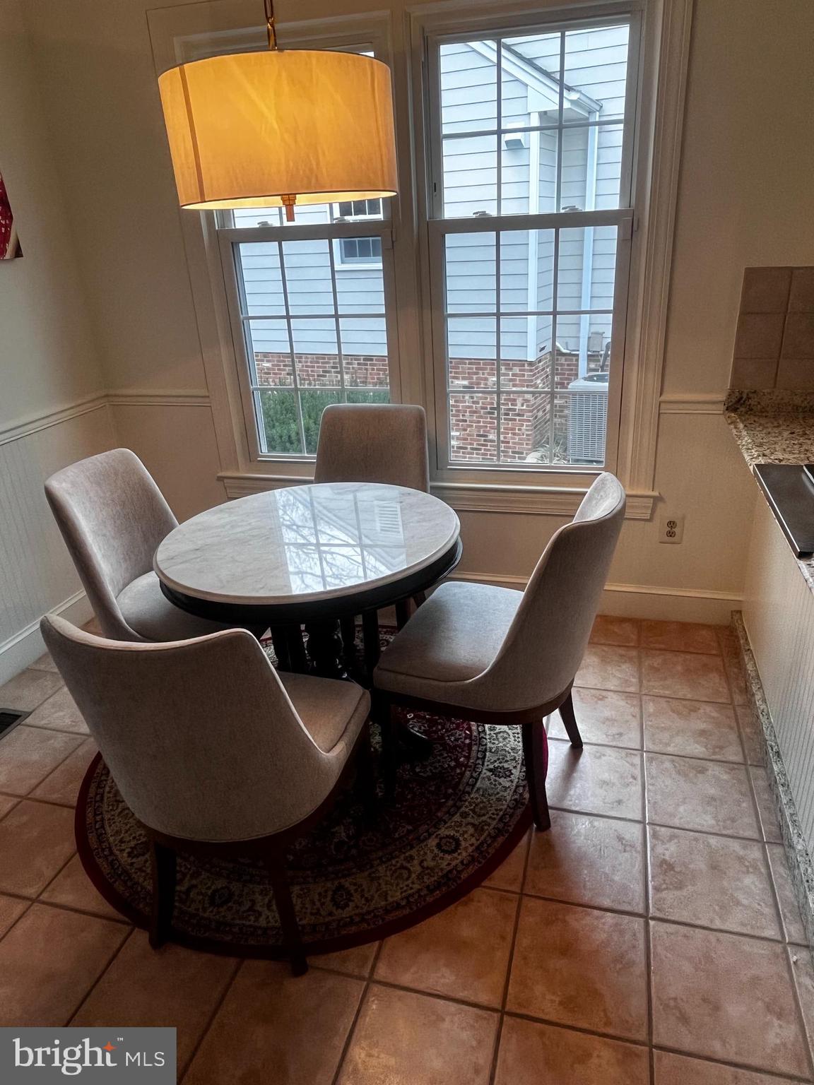 10207 Sundance Court Potomac, MD 20854 - Photo 6 of 21 a view of a dining room with furniture and window