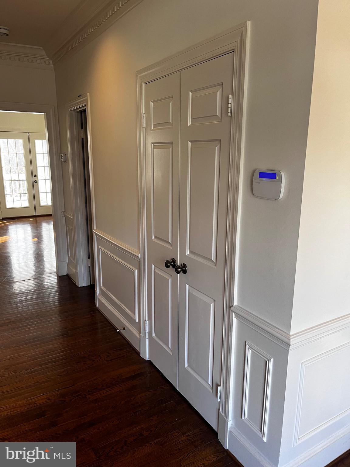 10207 Sundance Court Potomac, MD 20854 - Photo 10 of 21 a view of a hallway with wooden floor and stairs