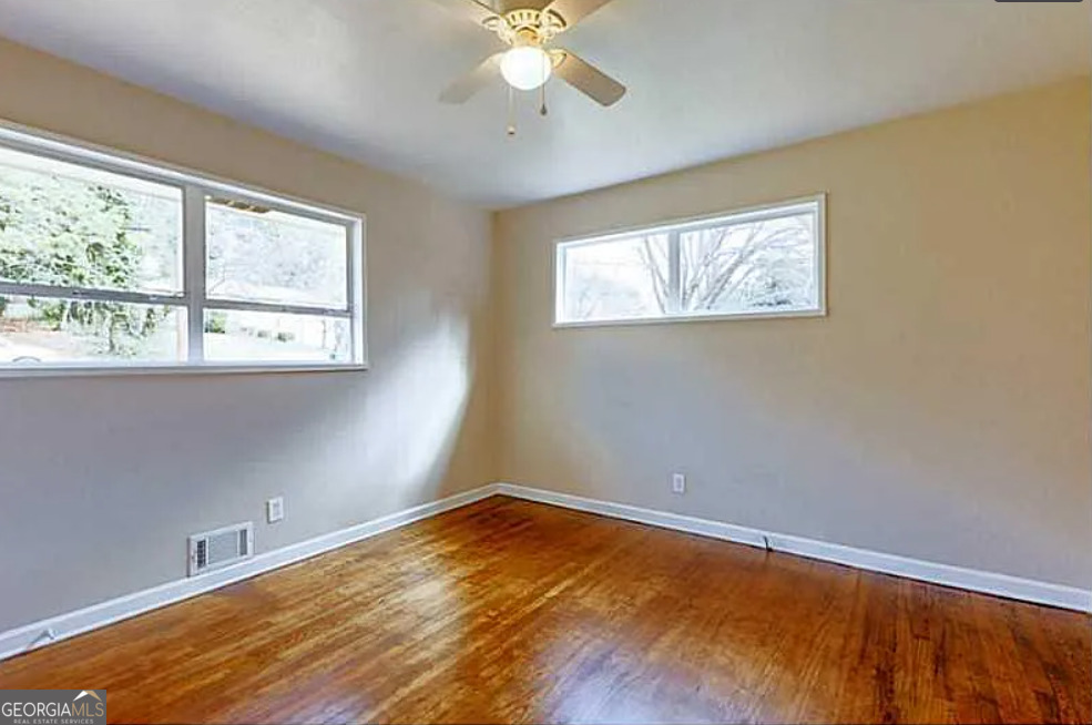 3405 Elgin Drive Decatur, GA 30032 - Photo 5 of 11 a view of empty room with wooden floor and fan