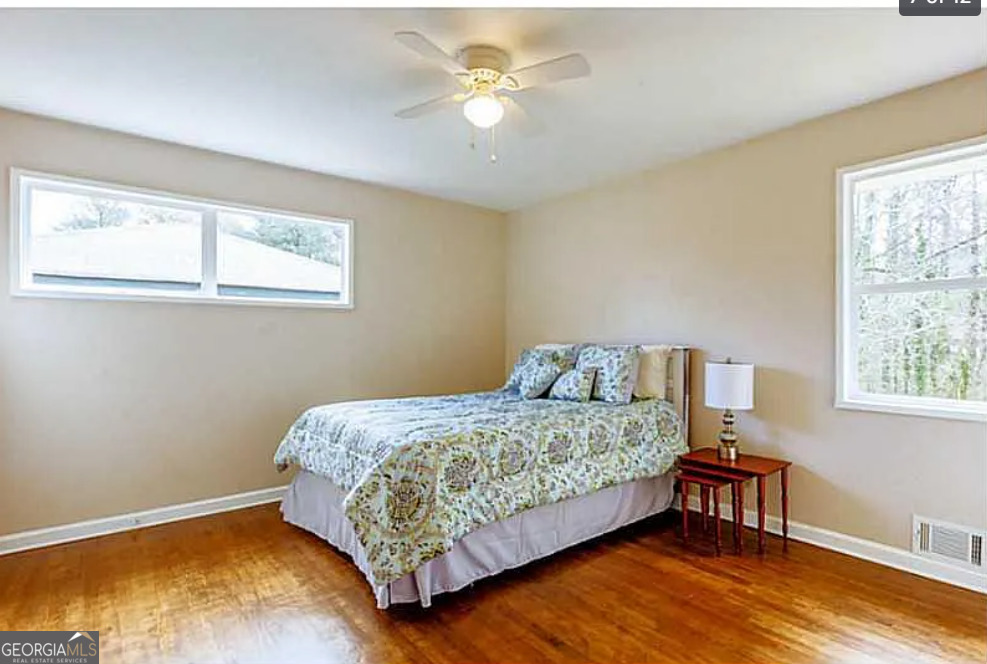 3405 Elgin Drive Decatur, GA 30032 - Photo 7 of 11 a bedroom with a bed chandelier and a window