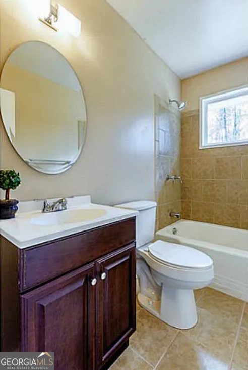 3405 Elgin Drive Decatur, GA 30032 - Photo 9 of 11 a bathroom with a sink a toilet and mirror