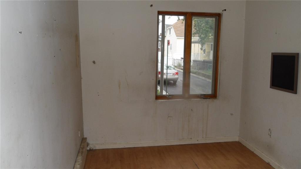 59 Bartlett Place Brooklyn, NY 11229 - Photo 4 of 13 an empty room with windows