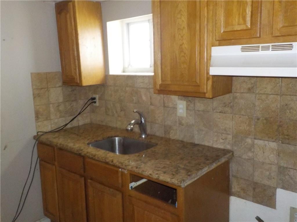 59 Bartlett Place Brooklyn, NY 11229 - Photo 6 of 13 a bathroom with a granite countertop sink and mirror