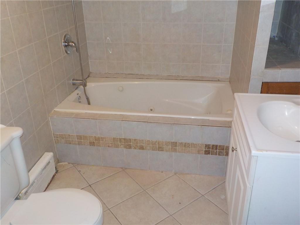 59 Bartlett Place Brooklyn, NY 11229 - Photo 7 of 13 a bathroom with a sink and toilet