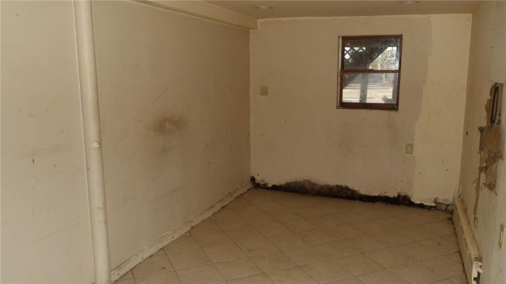 59 Bartlett Place Brooklyn, NY 11229 - Photo 9 of 13 an empty room with windows