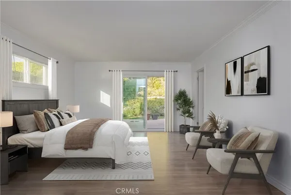 a spacious bedroom with a bed and glass door